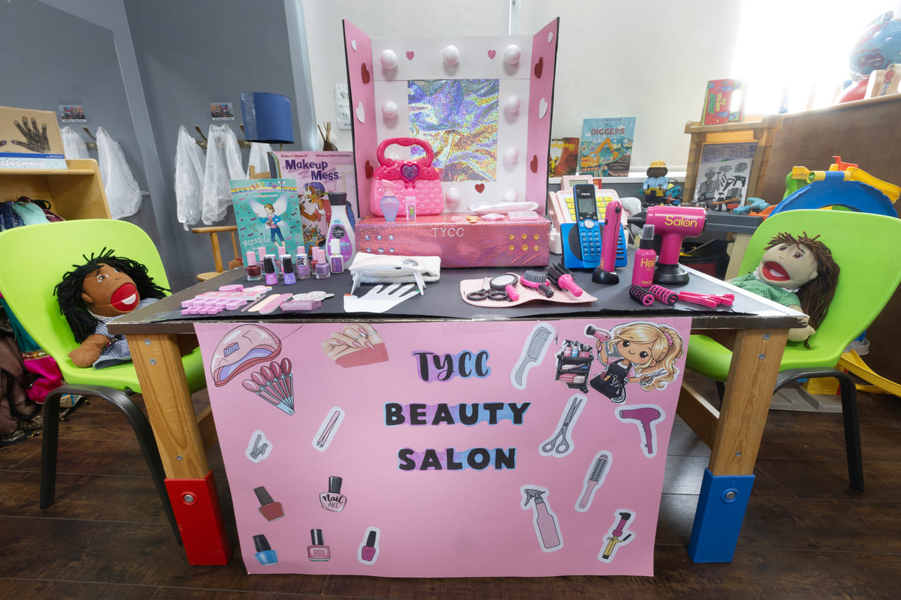 The beauty-salon dramatic-play station, where children cooperate and solve problems together