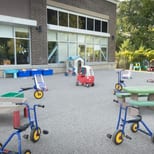 The larger Tender Years playground with tricycles, ride-on toys and picnic tables