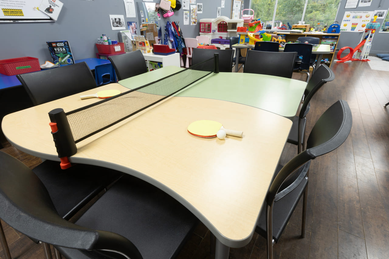 A school-age table set up for table tennis and group activities